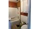 Cozy bathroom featuring a shower-tub combo, toilet, and white vanity for a functional space at 410 N Euclid Ave, Indianapolis, IN 46201