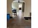 Open dining room features hardwood floors, neutral paint, and seamless transition to kitchen at 410 N Euclid Ave, Indianapolis, IN 46201