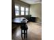 Bright dining room showcasing hardwood floors and natural light from a large window at 410 N Euclid Ave, Indianapolis, IN 46201