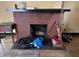 Close-up of brick fireplace with decorative mantel, ready for cozy evenings with room for firewood at 410 N Euclid Ave, Indianapolis, IN 46201