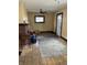 Inviting living room features a brick fireplace, hardwood floors, and natural light from the window at 410 N Euclid Ave, Indianapolis, IN 46201