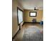 Spacious living room boasts hardwood floors, bright windows, and a ceiling fan for comfort at 410 N Euclid Ave, Indianapolis, IN 46201