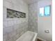 Bright bathroom with tiled wall feature and window at 415 W Gimber St, Indianapolis, IN 46225