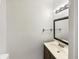 Powder room features a modern vanity and stylish lighting at 415 W Gimber St, Indianapolis, IN 46225