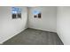 Spacious carpeted bedroom with two bright windows at 415 W Gimber St, Indianapolis, IN 46225