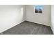 Cozy bedroom with neutral carpet and bright window at 415 W Gimber St, Indianapolis, IN 46225