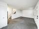 Spacious living room featuring neutral paint, plush carpet, and plenty of natural light at 415 W Gimber St, Indianapolis, IN 46225