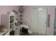 Bedroom with pink walls and a vanity with a furry stool at 4418 Tarragon Dr, Indianapolis, IN 46237