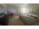Bedroom with neutral walls, a king-size bed, and a large window for natural light at 4418 Tarragon Dr, Indianapolis, IN 46237