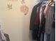 Walk-in closet featuring decorative accents and a large selection of hanging garments at 4418 Tarragon Dr, Indianapolis, IN 46237