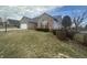 Charming single-Gathering home with brick accents, a two-car garage, and a well-maintained lawn and shrubbery at 4418 Tarragon Dr, Indianapolis, IN 46237