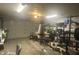 Garage interior featuring workout equipment, storage shelving, and an automatic door at 4418 Tarragon Dr, Indianapolis, IN 46237