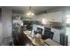 Kitchen featuring modern stainless steel appliances, light countertops, and ample lighting at 4418 Tarragon Dr, Indianapolis, IN 46237