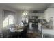 Kitchen with modern stainless steel appliances, light countertops, and ample lighting at 4418 Tarragon Dr, Indianapolis, IN 46237