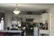 Kitchen featuring modern stainless steel appliances, white cabinets and ample lighting at 4418 Tarragon Dr, Indianapolis, IN 46237