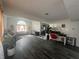 Open-concept living space featuring hardwood floors, two story ceilings, and an open office space at 4418 Tarragon Dr, Indianapolis, IN 46237