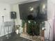 Living room featuring a fireplace with a mounted TV above and modern lighting at 4418 Tarragon Dr, Indianapolis, IN 46237