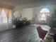 Bright open living room with hardwood floors, ample natural light, and stylish decor at 4418 Tarragon Dr, Indianapolis, IN 46237