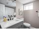 Cozy bathroom features a marble vanity, modern fixtures, and neutral paint at 4818 Guilford Ave, Indianapolis, IN 46205