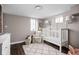 Charming Bedroom features a crib, accent chair, and playful decor creating a warm, inviting space at 4818 Guilford Ave, Indianapolis, IN 46205