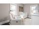 Cozy Bedroom with a white crib, comfortable seating, and soft colors for a peaceful atmosphere at 4818 Guilford Ave, Indianapolis, IN 46205