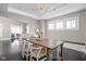 Dining area showcases a wooden table with modern chairs and transitions seamlessly into other living spaces at 4818 Guilford Ave, Indianapolis, IN 46205