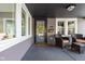 Cozy front porch with seating, offering a view of the neighborhood and natural light at 4818 Guilford Ave, Indianapolis, IN 46205