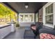 Inviting front porch with ample seating, perfect for enjoying the outdoors and neighborhood views at 4818 Guilford Ave, Indianapolis, IN 46205