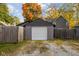 View of the detached garage with a new white garage door at 4818 Guilford Ave, Indianapolis, IN 46205