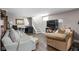 Hardwood floors, neutral walls and decor create a cozy atmosphere in the living room at 4818 Guilford Ave, Indianapolis, IN 46205