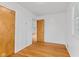 Bright bedroom features hardwood floors, built-in storage, and a large window at 488 N 24Th Ave, Beech Grove, IN 46107