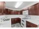 Well-equipped kitchen featuring updated appliances, countertops, and plentiful cabinet space at 488 N 24Th Ave, Beech Grove, IN 46107