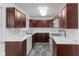 Well-equipped kitchen with stainless steel appliances and ample cabinet space at 488 N 24Th Ave, Beech Grove, IN 46107