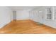 Bright living room with hardwood floors, fresh paint, and many windows bringing in natural light at 488 N 24Th Ave, Beech Grove, IN 46107