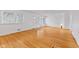 Inviting living room with hardwood floors, fresh paint, and sunny windows at 488 N 24Th Ave, Beech Grove, IN 46107
