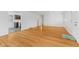 Open-concept living space with gleaming hardwood floors, plenty of natural light, and fresh paint at 488 N 24Th Ave, Beech Grove, IN 46107