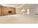 Finished basement featuring a brick fireplace and a convenient kitchenette at 5015 Watersite Cir, Indianapolis, IN 46254