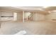 Finished basement with an open layout, kitchenette, and access to stairs at 5015 Watersite Cir, Indianapolis, IN 46254