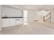 Finished basement featuring a stylish kitchenette and access to a stairway at 5015 Watersite Cir, Indianapolis, IN 46254