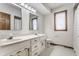 Bathroom featuring a double vanity, tile flooring, and a window at 5015 Watersite Cir, Indianapolis, IN 46254
