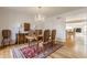 Formal dining room featuring a chandelier, buffet, and access to additional living space at 5015 Watersite Cir, Indianapolis, IN 46254