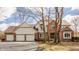 Charming two-story home with a brick facade, attached three-car garage, and well-maintained front yard at 5015 Watersite Cir, Indianapolis, IN 46254