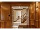 Open foyer with detailed trim and moldings lead to a staircase and offers a view of multiple rooms at 5015 Watersite Cir, Indianapolis, IN 46254