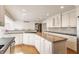 Spacious kitchen features granite countertops, stainless steel appliances, and a center island with a gas cooktop at 5015 Watersite Cir, Indianapolis, IN 46254