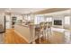 Bright kitchen featuring white cabinets, an island with bar seating, and stainless steel appliances at 5015 Watersite Cir, Indianapolis, IN 46254
