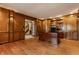 Spacious home office has wood-paneled walls, recessed lighting, a large desk, and built-in bookshelves at 5015 Watersite Cir, Indianapolis, IN 46254