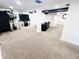 Finished basement with neutral carpet, a cozy seating area, and recessed lighting at 504 S Main St, Waldron, IN 46182