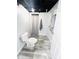Clean bathroom with essential fixtures, tile floors, and convenient amenities for daily use at 504 S Main St, Waldron, IN 46182