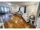 Spacious living room featuring hardwood floors, neutral décor, and ample natural light at 504 S Main St, Waldron, IN 46182