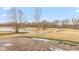 Backyard with a pond and a patio leading to a large grassy area, treeline on the back at 5344 Misthaven Ln, Greenwood, IN 46143